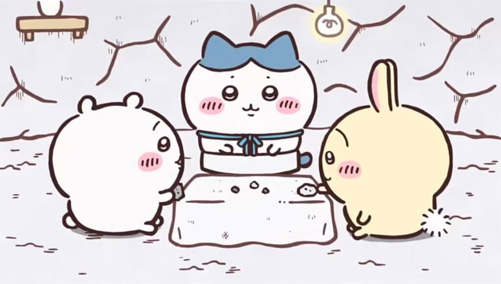 《吉伊卡哇》動畫截圖:吉伊卡哇、戴藍色頭巾的小八與兔子圍在地上的布墊旁